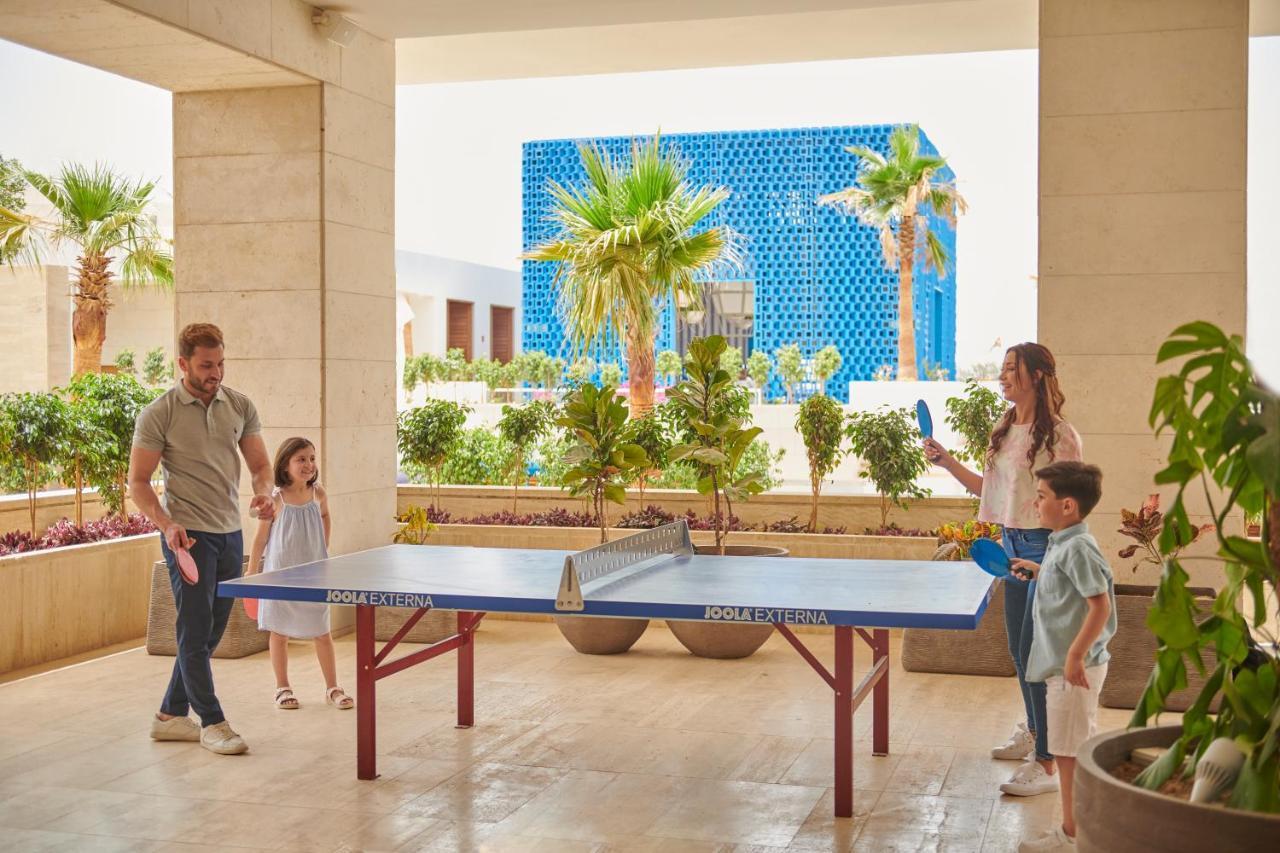 Hyatt Regency Aqaba Ayla Resort Exterior photo Family playing table tennis